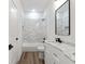 Bright bathroom featuring marble countertops, tiled shower, and modern fixtures at 5567 Tyree Rd, Winston, GA 30187