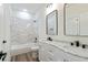 A full bathroom featuring a tub and shower combo, with double sink vanity at 5567 Tyree Rd, Winston, GA 30187