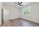 Bedroom featuring hardwood floors, large windows, and ceiling fan at 5567 Tyree Rd, Winston, GA 30187