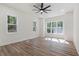 Bright bedroom featuring large windows that provide backyard views at 5567 Tyree Rd, Winston, GA 30187