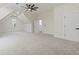 Large bonus room with cozy carpet, white walls, and plenty of natural light at 5567 Tyree Rd, Winston, GA 30187