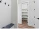 Entryway with built-in bench and access to pantry with shelving at 5567 Tyree Rd, Winston, GA 30187