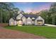 Stunning modern farmhouse with a manicured lawn and professional landscaping at 5567 Tyree Rd, Winston, GA 30187
