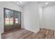 Entryway foyer with hardwood floors and doors that lead to the backyard at 5567 Tyree Rd, Winston, GA 30187