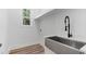 Laundry room with stainless steel sink and modern faucet at 5567 Tyree Rd, Winston, GA 30187