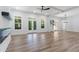 Modern living room with a glass fireplace, bright windows, and wood floors at 5567 Tyree Rd, Winston, GA 30187
