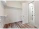 Bright walk-in closet features custom shelving and hardwood flooring at 5567 Tyree Rd, Winston, GA 30187