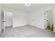 This bedroom features a bright white wall, carpet and an entrance to the bathroom at 6027 Windfall Ct, Powder Springs, GA 30127