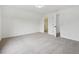 Carpeted bedroom features bright white walls and a closet at 6027 Windfall Ct, Powder Springs, GA 30127