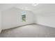Bright, carpeted bedroom with white walls and window views at 6027 Windfall Ct, Powder Springs, GA 30127
