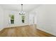 Dining room showcasing wood floors, windows, and classic trim at 6027 Windfall Ct, Powder Springs, GA 30127
