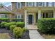Home's stone facade and manicured landscaping add to its curb appeal at 6027 Windfall Ct, Powder Springs, GA 30127