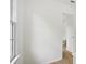 Hallway features fresh paint, clean trim, and vinyl flooring at 6027 Windfall Ct, Powder Springs, GA 30127