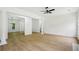 Open living room features neutral walls, wood floors and natural lighting at 6027 Windfall Ct, Powder Springs, GA 30127