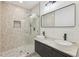 Modern bathroom with double sinks, updated lighting, and large glass enclosed shower at 1355 Lockwood Sw Dr, Atlanta, GA 30311