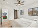 Spacious bedroom with natural light, two large windows, and a modern sliding barn door at 1355 Lockwood Sw Dr, Atlanta, GA 30311