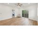 Bedroom featuring wood floors, recessed lights, balcony access, and view to the bathroom at 1355 Lockwood Sw Dr, Atlanta, GA 30311