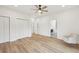 Bright and airy bedroom with wood floors, recessed lights, closet space, and an en suite bathroom at 1355 Lockwood Sw Dr, Atlanta, GA 30311