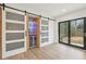 Bonus room with a wine fridge, pantry, and sliding glass door at 1355 Lockwood Sw Dr, Atlanta, GA 30311
