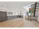 Bright, open kitchen featuring modern appliances, stylish gray cabinetry, and a unique light fixture at 1355 Lockwood Sw Dr, Atlanta, GA 30311