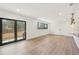 Bright living room with hardwood floors, sliding glass doors, and recessed lighting at 1355 Lockwood Sw Dr, Atlanta, GA 30311