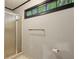 Modern bathroom featuring a glass-enclosed shower and ample natural light at 2908 Woodruff Se Dr, Smyrna, GA 30080
