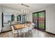 Stylish dining room with modern lighting, large windows, and seating for six at 2908 Woodruff Se Dr, Smyrna, GA 30080