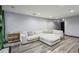 Cozy living room featuring a large sectional sofa and hardwood floors at 2908 Woodruff Se Dr, Smyrna, GA 30080