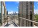 City views from this unit's private balcony with seating and glass railing at 361 17Th Nw St # 2607, Atlanta, GA 30363