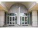 Modern building entrance featuring glass doors with building number and geometric transom design at 361 17Th Nw St # 2607, Atlanta, GA 30363