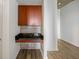 Dry bar featuring dark wood cabinets and backsplash at 361 17Th Nw St # 2607, Atlanta, GA 30363