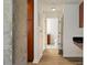 Hallway featuring wood flooring and a view to the bathroom at 361 17Th Nw St # 2607, Atlanta, GA 30363