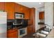Updated kitchen with stainless appliances, black countertops and wooden cabinets at 361 17Th Nw St # 2607, Atlanta, GA 30363