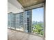 Open-concept living space with hardwood floors and floor to ceiling windows at 361 17Th Nw St # 2607, Atlanta, GA 30363