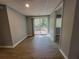 Finished basement with laminate floors and sliding door to backyard at 3796 Leesburg Sw Ct, Atlanta, GA 30331