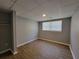 Finished basement features laminate flooring, closet, and window at 3796 Leesburg Sw Ct, Atlanta, GA 30331