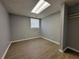 Finished basement with laminate flooring, closet, and window at 3796 Leesburg Sw Ct, Atlanta, GA 30331