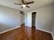 Bright bedroom with hardwood floors, ceiling fan, closet, and neutral paint at 3796 Leesburg Sw Ct, Atlanta, GA 30331