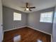 Bedroom featuring hardwood floors, a ceiling fan, and natural light from two windows at 3796 Leesburg Sw Ct, Atlanta, GA 30331
