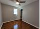 Bedroom featuring hardwood floors, neutral paint, a ceiling fan, and a closet at 3796 Leesburg Sw Ct, Atlanta, GA 30331