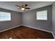 Bedroom featuring hardwood floors, neutral paint, and two large windows at 3796 Leesburg Sw Ct, Atlanta, GA 30331