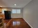 Dining area with hardwood floors, a window, and a view of the kitchen at 3796 Leesburg Sw Ct, Atlanta, GA 30331