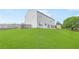 Exterior view of the home's backyard with large grassy lawn and wood fence at 1194 Grandview Cir, Powder Springs, GA 30127