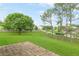 Spacious backyard with mature trees and a stone patio area at 1194 Grandview Cir, Powder Springs, GA 30127