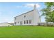 Spacious, grassy backyard showing the rear exterior of the two story home at 1194 Grandview Cir, Powder Springs, GA 30127