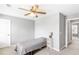Bedroom featuring a ceiling fan, carpeted floors, a small bed and minimal furniture at 1194 Grandview Cir, Powder Springs, GA 30127