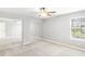 Spacious bedroom with mirrored closet doors and large window for ample natural light at 1194 Grandview Cir, Powder Springs, GA 30127