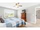 Cozy bedroom featuring neutral tones, a ceiling fan, and a window offering plenty of natural light at 1194 Grandview Cir, Powder Springs, GA 30127