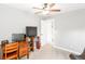 Cozy bedroom with a desk, flat screen TV, and an open door to the rest of the house at 1194 Grandview Cir, Powder Springs, GA 30127