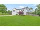 View of a beautiful two-story home featuring a well-maintained yard and a two-car garage at 1194 Grandview Cir, Powder Springs, GA 30127